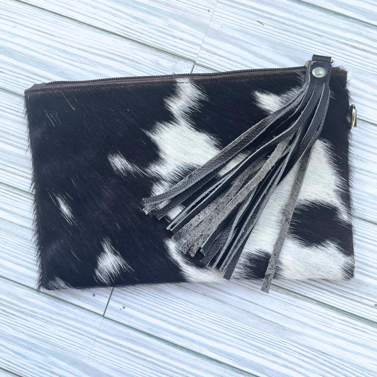 Black and White Cowhide Wristlet Clutch with Leather Tassle