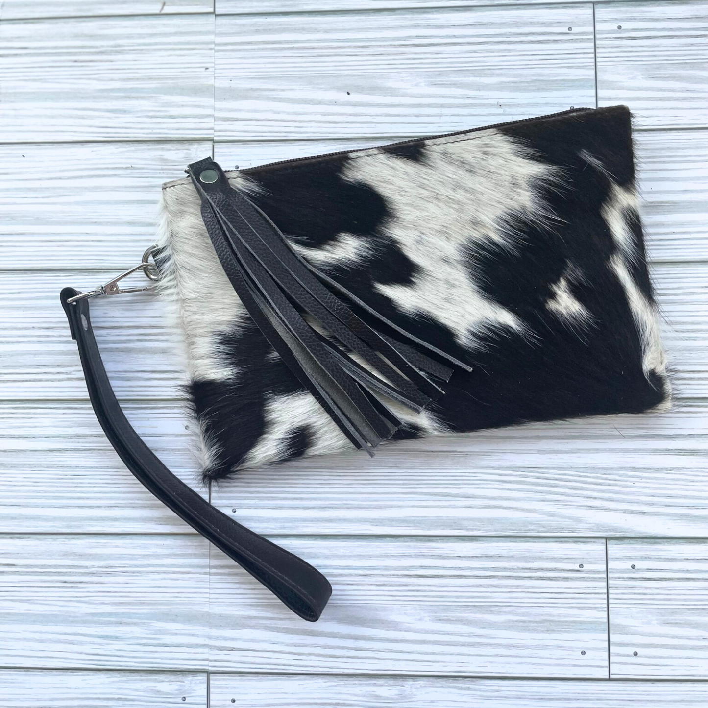 Black and White Cowhide Wristlet Clutch with Leather Tassle